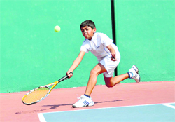 A player in action at the 10th Uttarakhand Open Junior Tennis Tournamant in Dehradun on Saturday