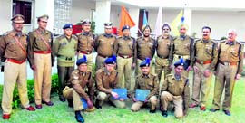 CRPF Special DG, J&K Zone, NK Tripathi along with two SSPs of the state police and CRPF jawans, who were awarded DGs commendation discs and letters, in Jammu on Saturday