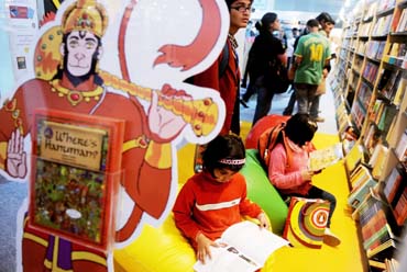 BOND WITH BOOKS: Children read at a stall