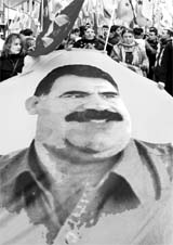 Kurdish protesters hold a flag with a portrait of jailed Kurdistan Workers Party leader Abdullah Ocalan during a demonstration in Strasbourg on Saturday.