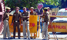 Policemen keep vigil at Kamla Market in New Delhi on Sunday.