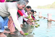People float diyaas as a tribute to victims of the Pune terror attack in the Ganga in Haridwar on Sunday.