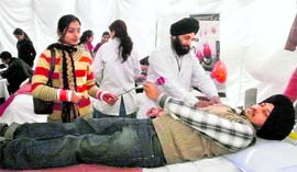 Gurdeep Singh, a tourist from Bathinda, donates blood on Valentines Day at a camp organised in Shimla on Sunday