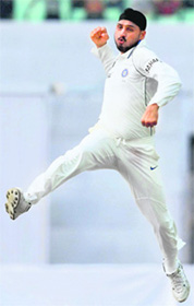 Harbhajan Singh celebrates the wicket of Ashwell Prince on Sunday.