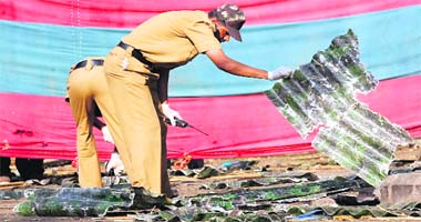Forensic experts look for evidence at the site of the IED blast at German Bakery in Pune on Sunday.
