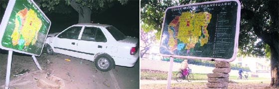 A car hits a signboard near the Him Parisar (left) and the next day, the signboard is propped up with stones at Sector 37 in Chandigarh.