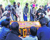 The coffin of Frederick Smetacek Junior, known as Indias butterfly man, being lowered into the grave at Bhimtal