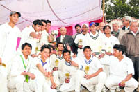 The team members of Abhimanyu Cricket Academy receive trophy after winning the u-17 District Cricket League in Dehradun 
