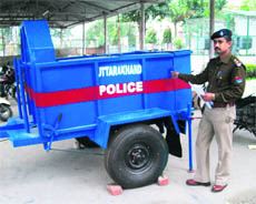    A member of the bomb disposal squad with the newly acquired bomb-disposal trailer. 