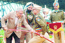 Chief Minister Bhupinder Singh Hooda presents the Sword of Honour to Assistant Commandant Saurabh Awasthi at CRPF Academy in Kadarpur, Gurgaon,