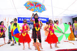 Students of RS Public Senior Secondary School participate in a baby show in Karnal.