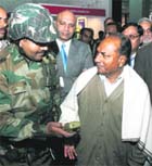 Defence Minister AK Antony interacts with a jawan at DefExpo-2010 in New Delhi.
