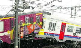 The wreckage of two commuter trains is seen in Buizingen, Belgium, on Monday.