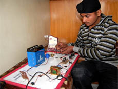 Gurpreet Singh demonstrates his project in Amritsar.