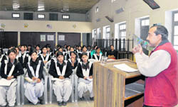 R Mukherjee, Director, Technical and Research Network, delivers a talk at Phulchand Nari Shilp Mandir Girls Inter-College in Dehradun 