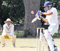 A batsman tries to glide the ball during a match at the SC Memorial Cricket Tournament in Dehradun 