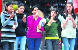 Girls enjoy ice cream at the Sector 17 plaza in Chandigarh as the mercury rose by a few notches