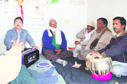 Holiyars, traditional Holi singers, during a recital in Pitthoragarh town.