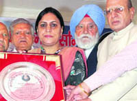 Members of different NGOs present Kalpana Chawla Gaurav Samman to MLA Sumita Singh at a function in Karnal on Wednesday.