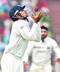 Subramaniam Badrinath takes the catch of Alviro Petersen in Kolkata on Wednesday.  Reuters