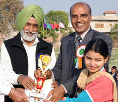 Former hockey Olympian Ajit Singh honours the best girl athlete Deepa.