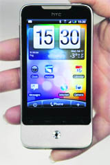 A woman holds an HTC Legend smartphone at the Mobile World Congress in Barcelona on Thursday.