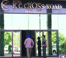 The police outside KC Crossroad during a raid conducted by the income tax department in Sector 10, Panchkula, on Thursday. 