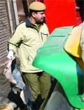A fire department official at Shastri Nagar godown in New Delhi on Thursday.