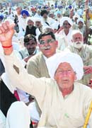A farmer raises slogans at a mahapanchayat of the Bharatiya Kisan Union, Haryana, in Karnal on Thursday.
