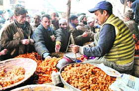 People buy traditional Kashmiri paratha in Srinagar