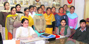 Principal Paramjit Kaur, Prof Savinderpal Kaur and Prof Vikram Thakur along with the girls who won US scholarships at the Khalsa College for Women, Sidhwan Khurd.
