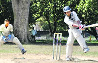 A batsman gets into an awkward position while playing his shot at the Chandan Singh Thapali Memorial Cricket Tournament at Matawalabag Grounds in Dehradun 