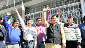 UKD workers hold a demonstration in front of the office of the District Magistrate, Dehradun, on Friday.