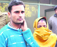 Seven months pregnant Reena with her husband Anil Kumar at the Punjab and Haryana High Court in Chandigarh 