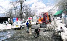 Widening and carpeting work in progress on the Manali-Leh highway,near Bahang, 4 km from Manali, on Friday. 