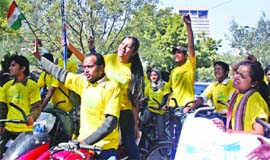 Activists of Yuva Koshish promote the forthcoming Hockey World Cup in New Delhi on Saturday.