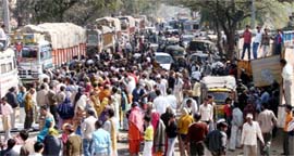 Residents of Garhi Hashru block road in protest against the removal of encroachments at Patoudi Road in Gurgaon on Saturday.