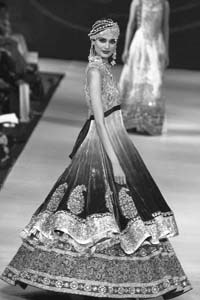A Pakistani model presents a creation during a fashion show in Lahore