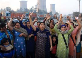 Vishal Nagar residents protesting against the Railways for loading and unloading coal racks near their locality which has been causing breathing problems to the residents, in Bathinda, on Sunday