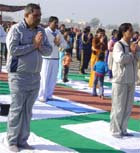 BSF men and their family members practicing yoga at Abohar.