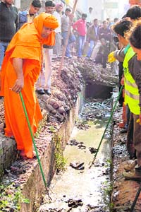 Soham Baba cleans up a nullah at Ranipur in Haridwar