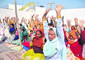 Women do prayanama at a camp in Dehradun