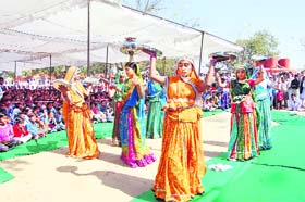 Students perform a dance in a school in Kaluana village in Sirsa
