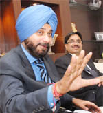 MP Navjot Singh Sidhu addresses mediapersons in Jalandhar on Sunday. 