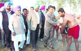 Manish Tewari encourages kabaddi players during the rural sports festival at Jodhan village