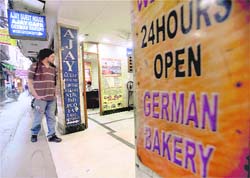 A tourist outside the German Bakery at the Paharganj area in New Delhi.
