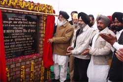Chief Minister Parkash Singh Badal lays the foundation stone of a college at his native Ghudda village near Bathinda on Sunday.