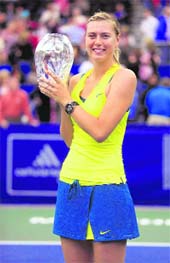Maria Sharapova holds the championship trophy following her victory over Sofia Arvidsson during the finals of the Cellular South Cup tennis tournament in Memphis, on Saturday. Sharapova defeated Arvidsson 6-2, 6-1. 