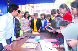 Students at a stall during a job fest at MCM DAV College, Sector 36, in Chandigarh