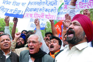 BJP activists protest against the killing of two Sikh traders in Pakistan, near Pakistan embassy in New Delhi on Monday.